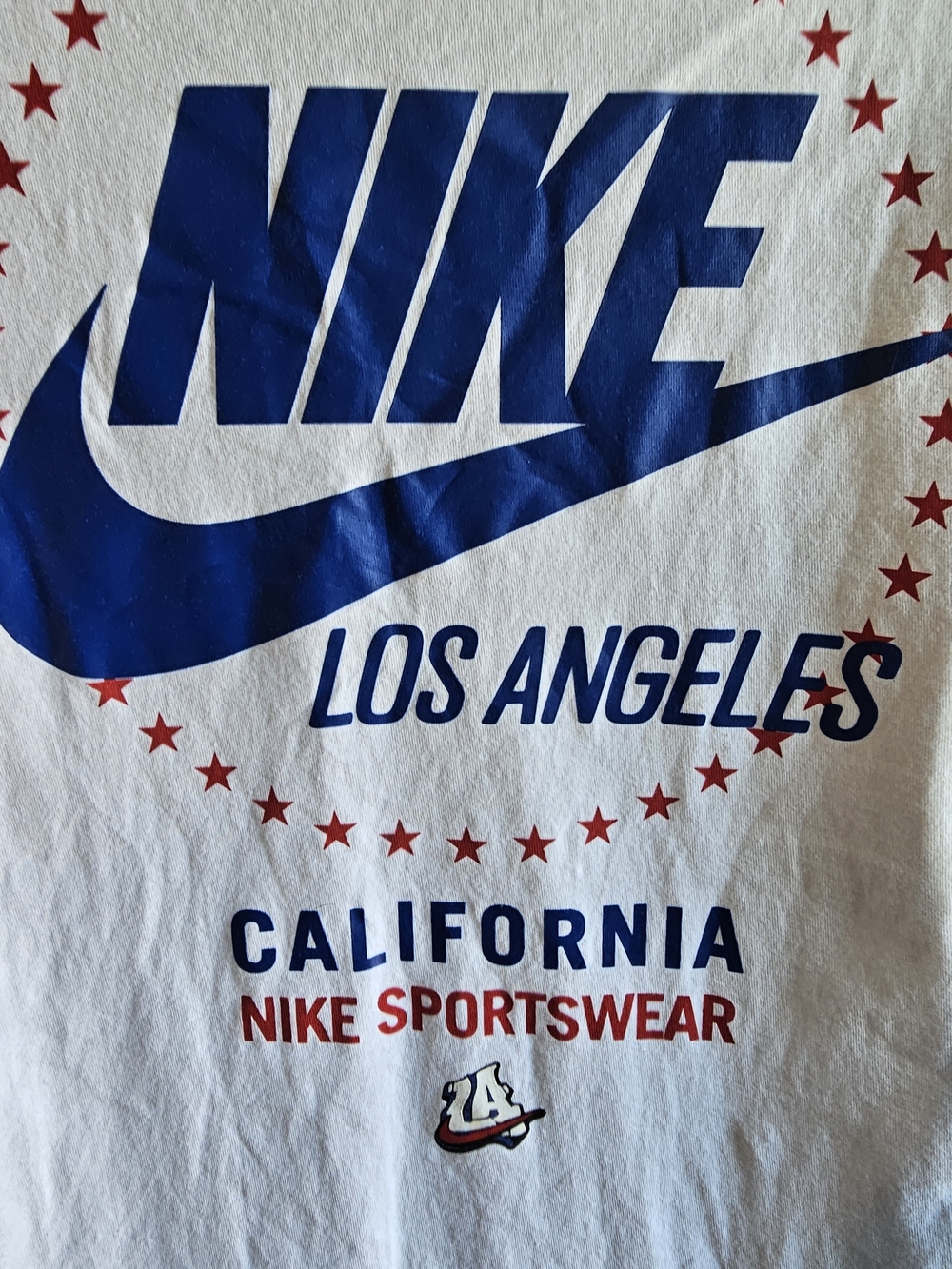Nike White Short Sleeve Tee with Blue Logo and Red Accents